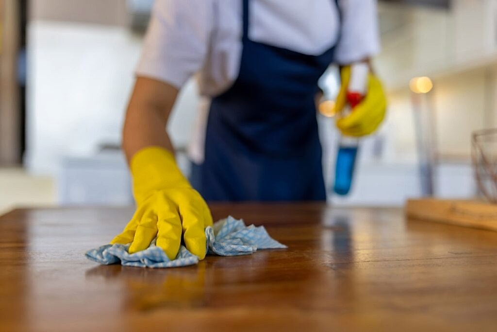 Deep Cleaning Service Wiping Table Close-up